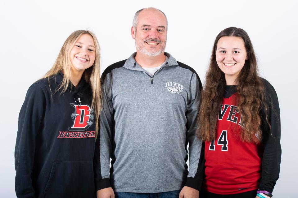 Dover girls' basketball head coach Cory Matthews poses for a photo with players Makenzie Gamber (left) and Kailee Mathews during YAIAA winter sports media day on Thursday, November 10, 2022, in York.
