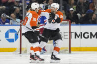 Philadelphia Flyers right wing Bobby Brink (10) celebrates with center Ryan Poehling (25) after scoring against the New York Rangers during the second period of an NHL hockey game Thursday, April 11, 2024, at Madison Square Garden in New York. (AP Photo/Mary Altaffer)