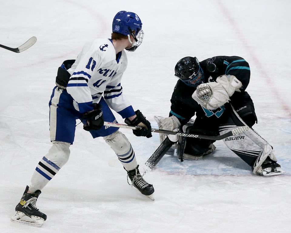 Plymouth South goalie Tristian Holmes makes a nice save on a shot by Scituate’s Jimmy Sullivan during first period action of their game against Scituate at Hobomock Ice Arena in Pembroke on Saturday, Feb. 11, 2023. 