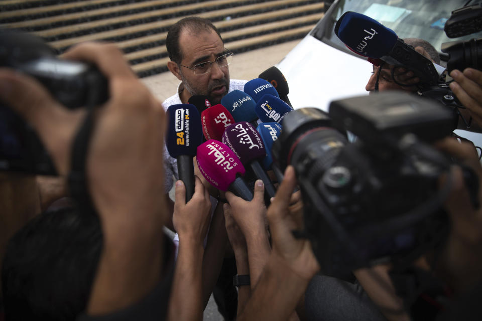 Suleyman Rissouni, uncle of journalist Hajar Rissouni and editor in chief of Akhbar Al-Youm daily newspaper, speaks to the media after the court delivered a one year prison sentence to his niece on accusations of her undergoing an illegal abortion, in Rabat, Morocco, Monday, Sept. 30, 2019. The 28-year old Moroccan journalist Hajar Raissouni was sentenced to one year in prison, Monday, while her fiancé also received a one-year sentence and the doctor accused of terminating the pregnancy was sentenced to two years in jail and suspended from practicing. (AP Photo/Mosa'ab Elshamy)