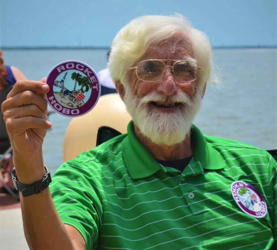 Ozzie Osband holds a Rocket Hobo patch at Space View Park in Titusville.