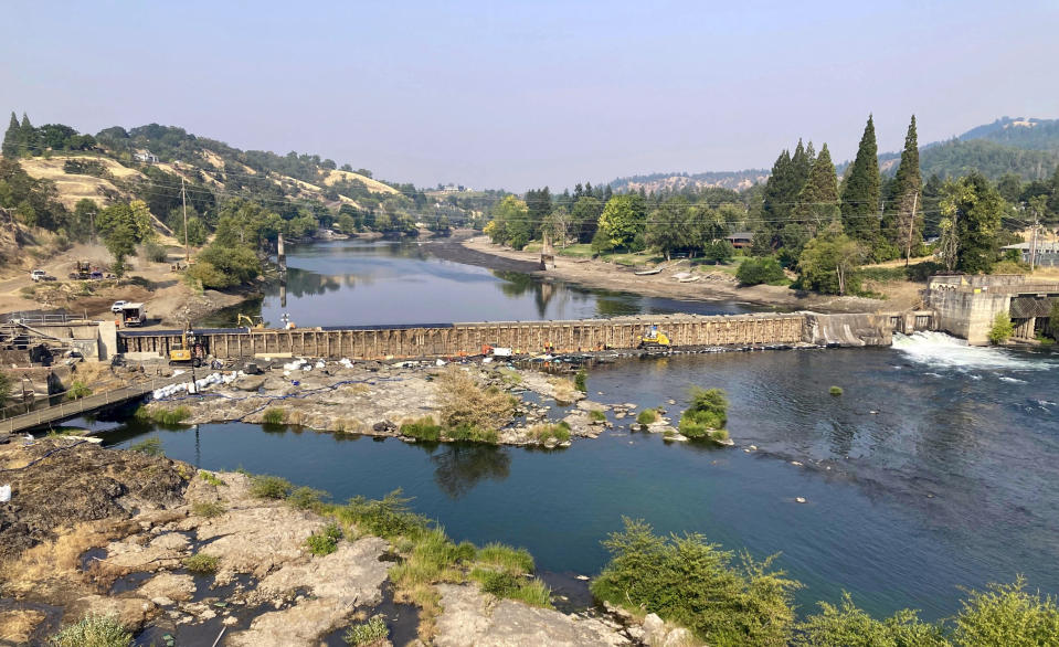 In this photo provided by James V. McCarthy, Oregon’s Winchester Dam, about five miles north of Roseburg, Ore., undergoes repairs Aug. 20, 2023. Oregon officials are seeking more than $27 million in damages over the dam repairs that they say killed more than half a million Pacific lamprey fish. The Oregon Department of Fish and Wildlife filed the claim in Douglas County Circuit Court on Friday, Oct. 6, 2023. (James V. McCarthy via AP)