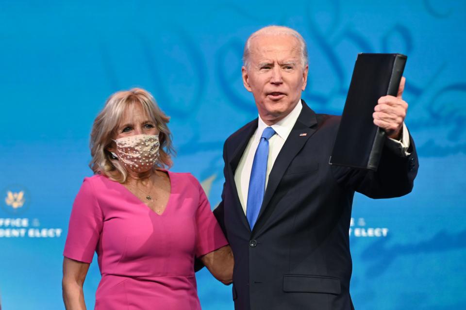 US President-elect Joe Biden arrives with wife Jill Biden to deliver remarks on the Electoral college certification at the Queen Theatre in Wilmington, Delaware on December 14, 2020. (Photo by ROBERTO SCHMIDT / AFP) (Photo by ROBERTO SCHMIDT/AFP via Getty Images)