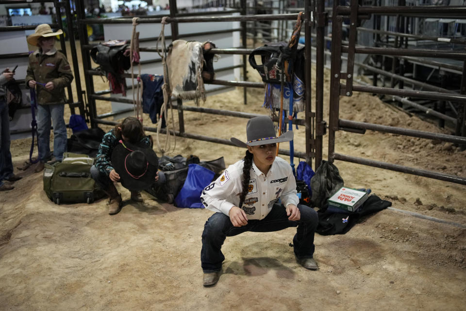 Najiah Knight warms up before competing in the bull riding competition during the Junior World Finals rodeo, Thursday, Dec. 7, 2023, in Las Vegas. (AP Photo/John Locher)