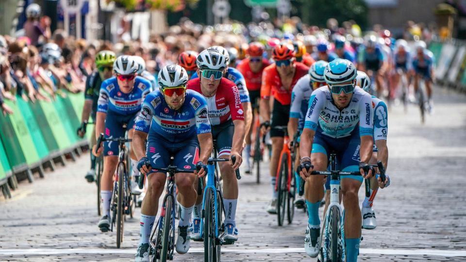 The peloton passes through the town centre on stage one of the 2024 Lloyds Bank Tour of Britain Men in Kelso in the Scottish Borders.