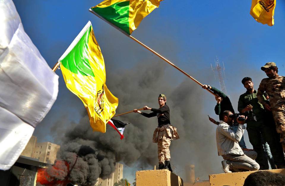 Protesters burn property in front of the U.S. Embassy compound, in Baghdad, Iraq, Tuesday, Dec. 31, 2019. Dozens of angry Iraqi Shiite militia supporters broke into the U.S. Embassy compound in Baghdad on Tuesday after smashing a main door and setting fire to a reception area, prompting tear gas and sounds of gunfire. (Photo: Khalid Mohammed/AP)  