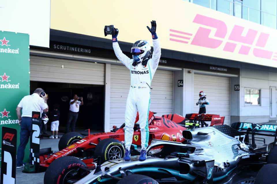 Mercedes' Finnish driver Valtteri Bottas celebrates his victory at the end of the Formula One Japanese Grand Prix final at Suzuka on October 13, 2019. (Photo by Behrouz MEHRI / AFP) (Photo by BEHROUZ MEHRI/AFP via Getty Images)