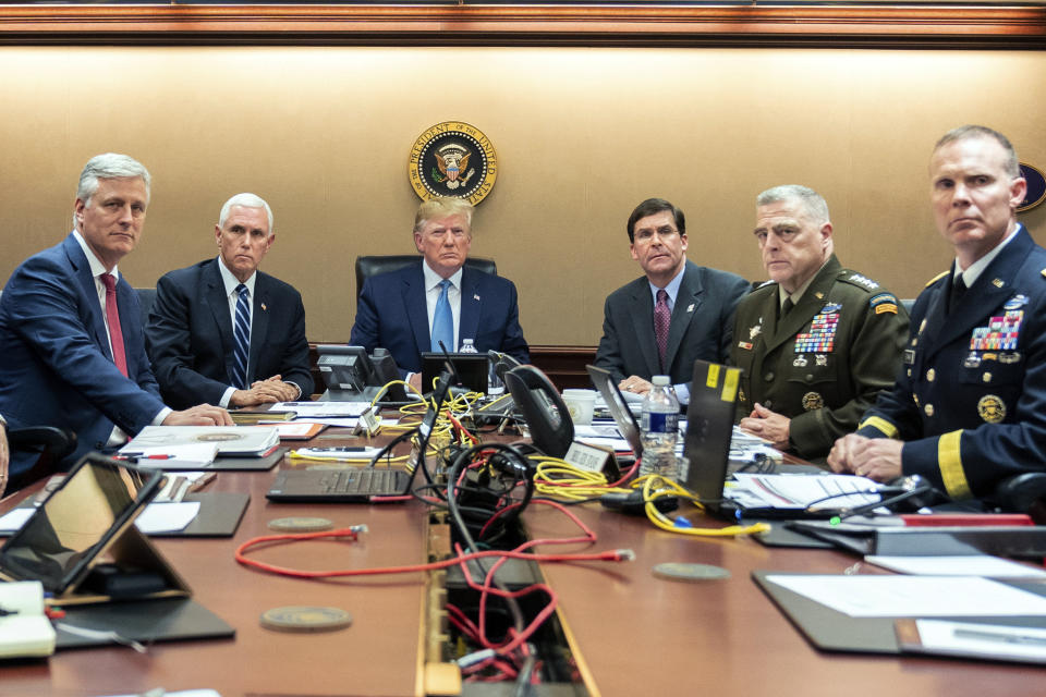 FILE - In this photo provided by the White House, President Donald Trump is joined by from left, national security adviser Robert O'Brien, Vice President Mike Pence, Defense Secretary mark Esper, Joint Chiefs Chairman Gen. Mark Milley and Brig. Gen. Marcus Evans, Deputy Director for Special Operations on the Joint Staff, Saturday, Oct. 26, 2019, in the Situation Room of the White House in Washington, monitoring developments in the U.S. Special Operations forces raid that took out Islamic State leader Abu Bakr al-Baghdadi. (Shealah Craighead/The White House via AP, File)