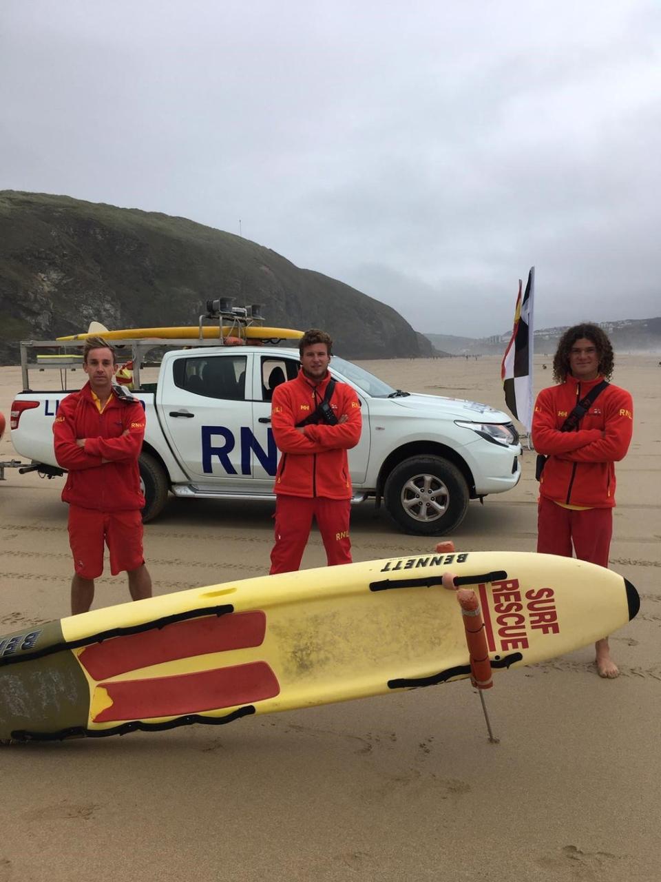 Lifeguards Tomo Harder, Charley Florey and Ben Evans after Saturday’s rescue (RNLI/PA)