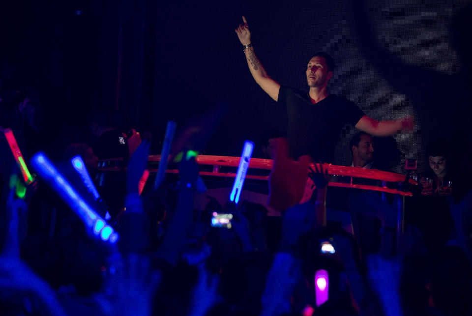 DJ Cedric Gervais performs for revelers at the Surrender nightclub in Las Vegas on Sunday, Jan. 20, 2013. (AP Photo/Julie Jacobson)
