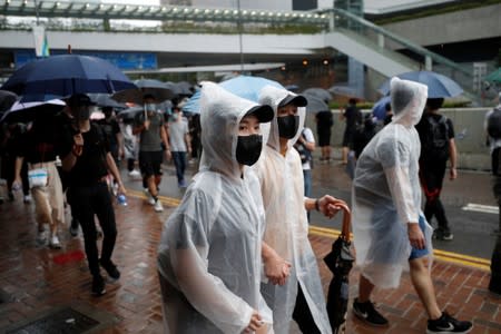 Masked protesters attend an anti-government rally in central Hong Kong