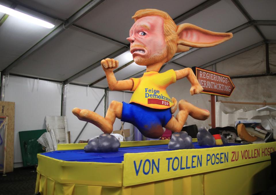 <p>A carnival float, depicting Leader of the Free Democrats Party (FDP) Christian Lindner as a rabbit running, is being prepared at a warehouse ahead of a carnival parade on Rose Monday on Feb. 12, 2018 in Duesseldorf, southern Germany. (Photo: Marcel Kusch/Getty Images) </p>