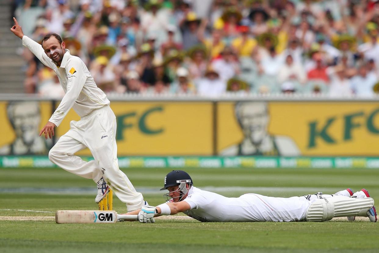 Low point: Australia’s Nathan Lyon celebrates as Joe Root is run out by Mitchell Johnson for 15 at Melbourne in the second innings of the fourth Test of the 2013/14 Ashes: Getty Images