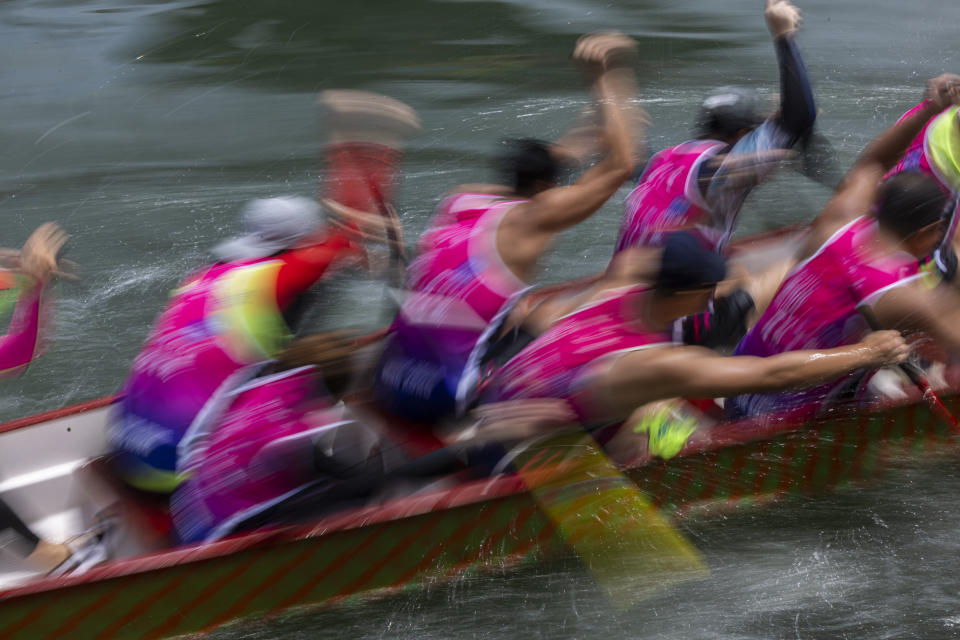 Competitors take part in the annual dragon boat race to celebrate the Tuen Ng festival in Hong Kong, Thursday, June 22, 2023. (AP Photo/Louise Delmotte)