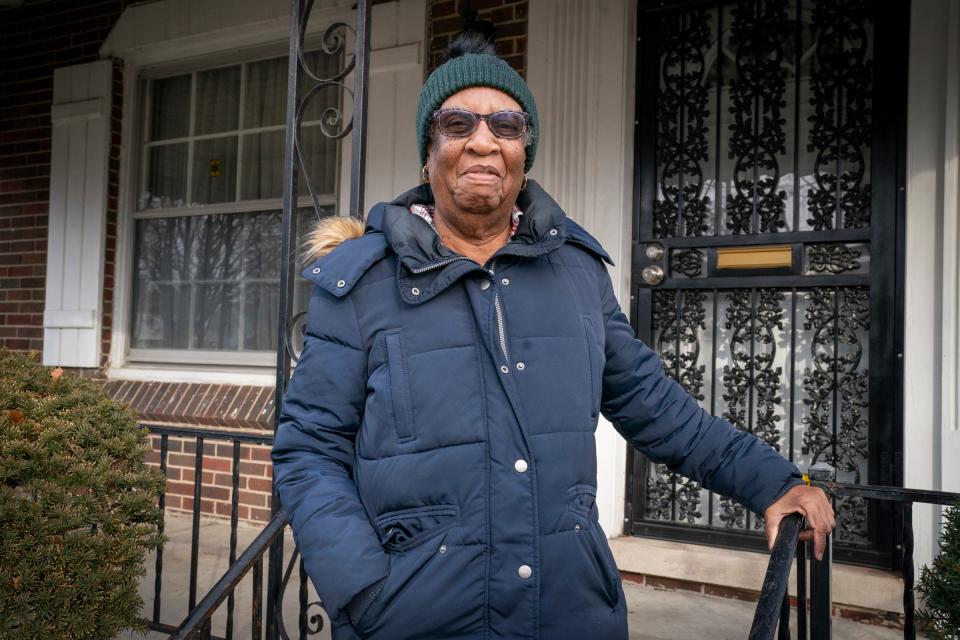 Georgia Taylor, 91, fought long and hard to have an abandoned house knocked down next to her Detroit home with the help of Detroit Free Press columnist M.L. Elrick. She stands in front of her home on Thursday, Dec. 21, 2023.
