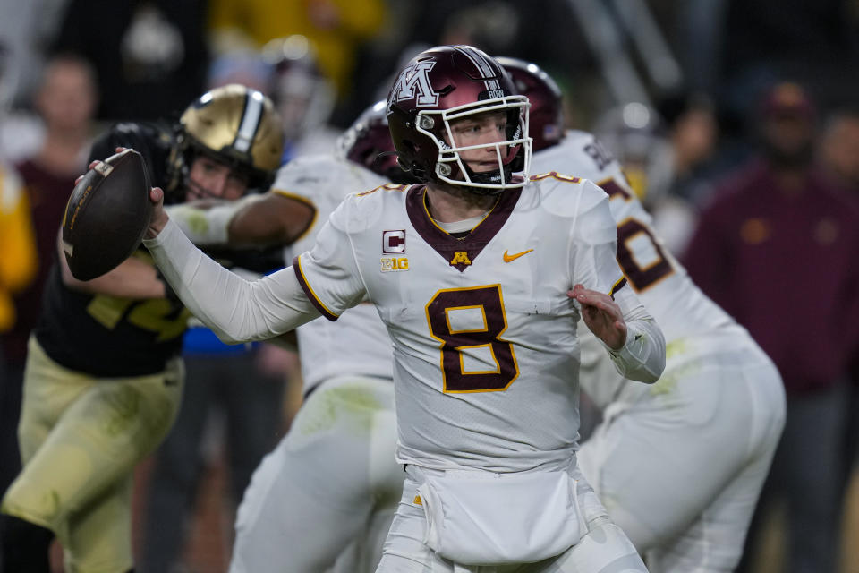 Minnesota quarterback Athan Kaliakmanis (8) throws against Purdue during the second half of an NCAA college football game in West Lafayette, Ind., Saturday, Nov. 11, 2023. (AP Photo/Michael Conroy)