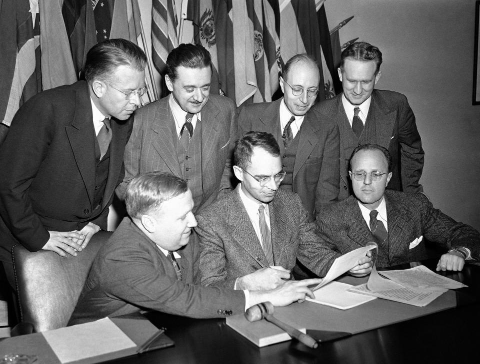 Directors of Principal Research Centers under the U.S. Atomic Energy Commission confer in Washington, D.C., on Jan. 18, 1947, preparing an overall report on the status of atomic research projects. Left to right are: front row, Dr. F. H. Spedding, Iowa State College; Carroll L. Wilson, General Manager, atomic energy commission; and Dr. C. G. Suits of the General Electric Laboratory, Schenectady, N.Y.; rear, Dr. E. O. Lawrence, University of California, Dr. M. Morse, Brooklyn National Laboratory, Patchogue, N.Y.; Dr. Eugene P. Wigner, Clinton Laboratories, Oak Ridge, Tenn., and Dr. W. H. Zinn, Argonne National Laboratory, Chicago. (AP Photo)