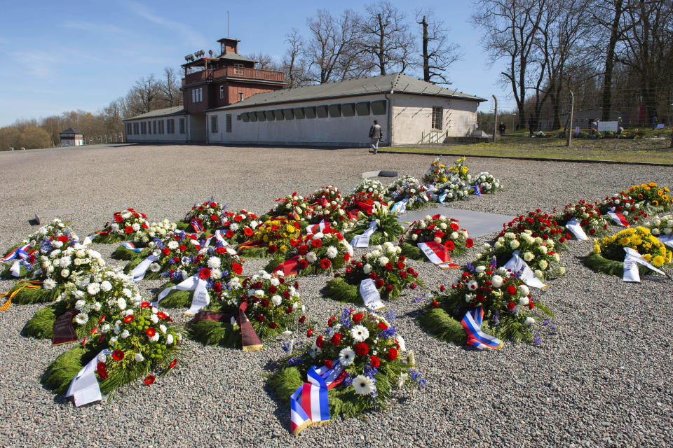 Wreaths are placed at the memorial for the victims at the 75th anniversary of the liberation of the former Nazi concentration camp Buchenwald by the US Army near Weimar, Germany, Saturday, April 11, 2020. Because of Corona crisis, the memorial is currently closed and all commemoration ceremonies with survivors have been cancelled. For most people, the new coronavirus causes only mild or moderate symptoms, such as fever and cough. For some, especially older adults and people with existing health problems, it can cause more severe illness, including pneumonia. (AP Photo/Jens Meyer)