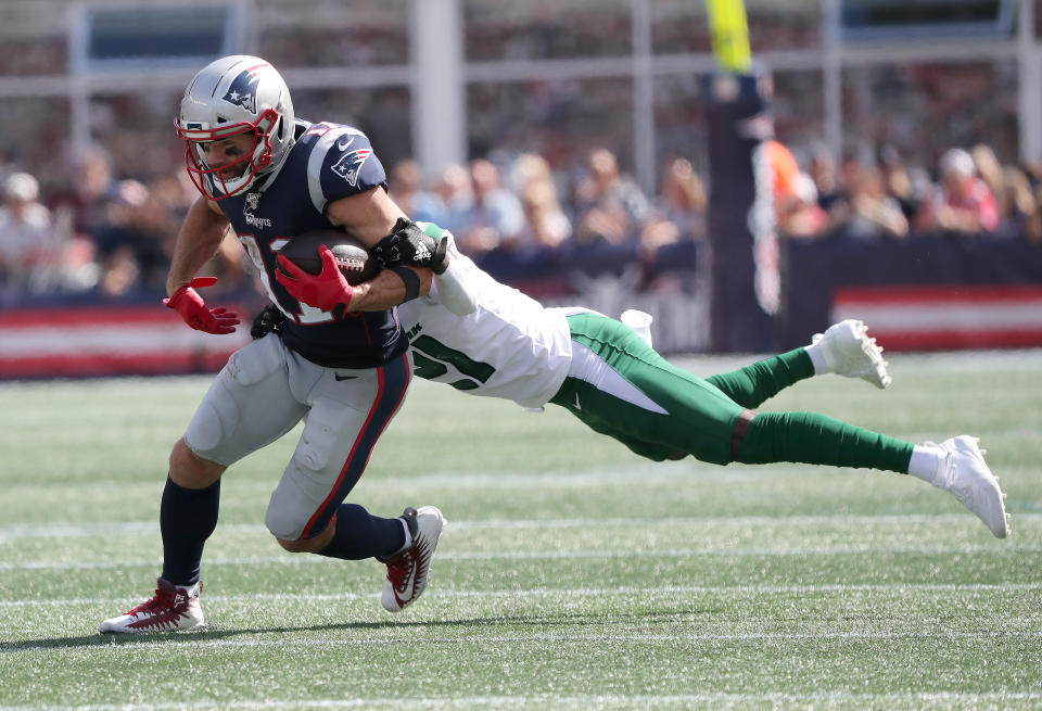 The Patriots' Julian Edelman scored a TD against the Jets on Sunday but also left with a chest injury. (Getty Images)