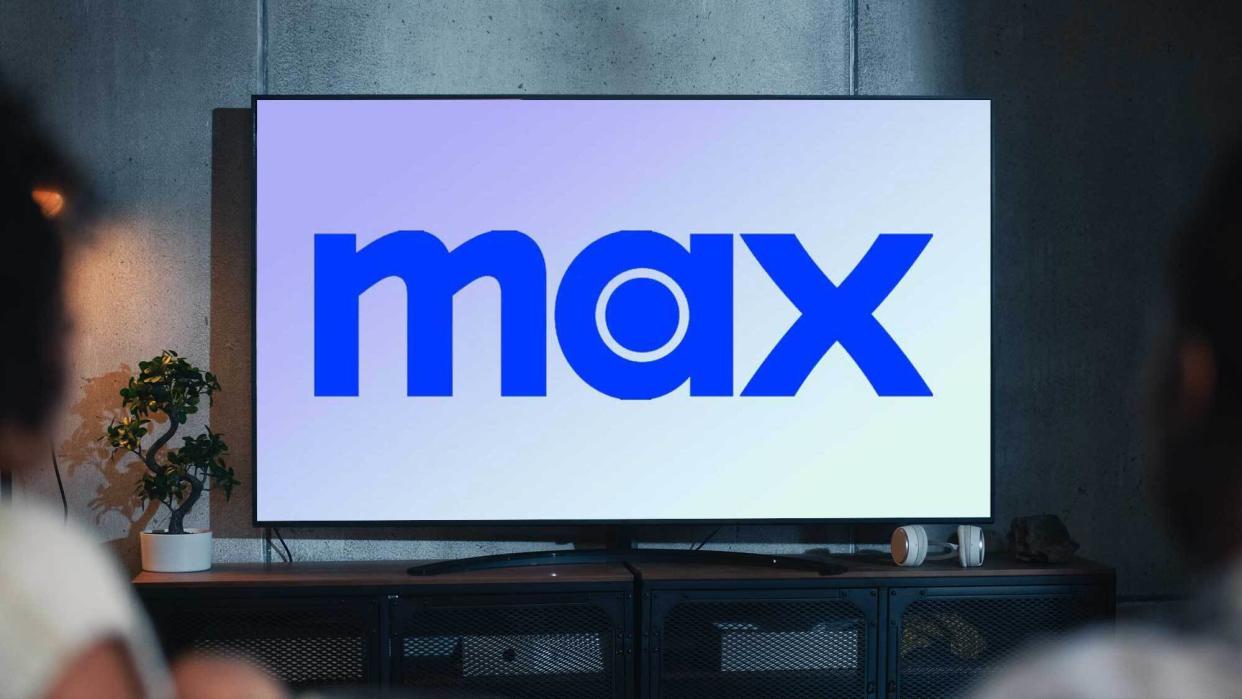  The Max logo appears on a TV in a darkened living room. 