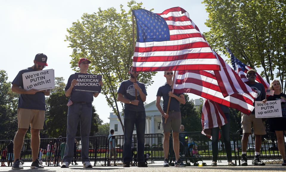 <p>Protesters gather outside the White House in Washington, Saturday, Sept. 16, 2017, during a rally encouraging President Donald Trump and House Speaker Paul Ryan to defend American democracy from Russian interference. (Photo: Susan Walsh/AP) </p>