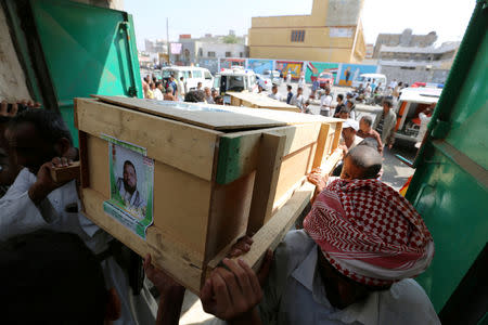 FILE PHOTO: Mourners carry the coffin of a victim who killed by shells that hit a house in Hodeidah, Yemen December 10, 2018. Picture taken December 10, 2018. REUTERS/Abduljabbar Zeyad/File Photo