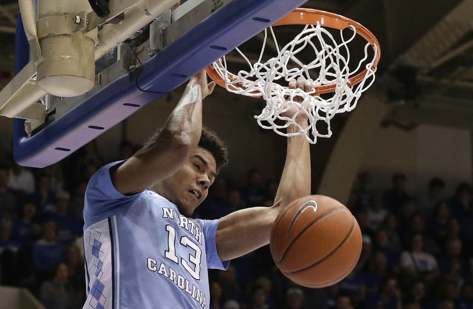 North Carolina's Cameron Johnson (13) dunks against Duke during the first half of an NCAA college basketball game in Durham, N.C., Wednesday, Feb. 20, 2019. (AP Photo/Gerry Broome)