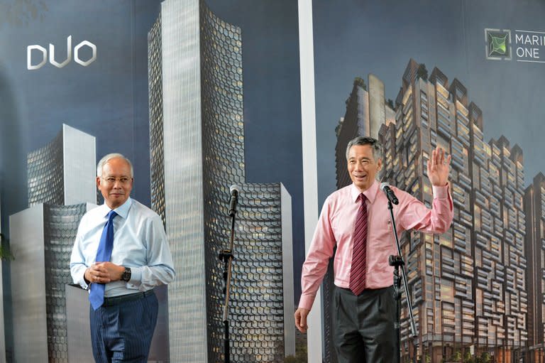 Singapore's Prime Minister Lee Hsien Loong (right) and Malaysia's Prime Minister Najib Razak (left) attend the Marina One unveiling ceremony in Singapore on February 19, 2013. Singapore and Malaysia announced plans Tuesday to build a high-speed rail link, fuelling hopes that Southeast Asia could one day enjoy a rapid European-style train system connected to China