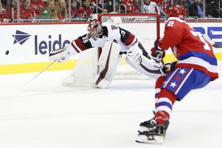 Nov 11, 2018; Washington, DC, USA; Arizona Coyotes goaltender Darcy Kuemper (35) makes a save against Washington Capitals center Travis Boyd (72) during the first period at Capital One Arena. Amber Searls-USA TODAY Sports