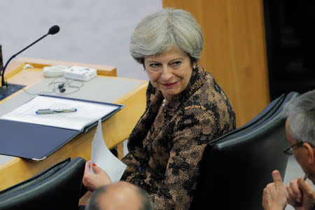 British Prime Minister Theresa May speaks with a colleague during a meeting to discuss the current situation in Libya during the 72nd United Nations General Assembly at U.N. headquarters in New York, U.S., September 20, 2017. REUTERS/Lucas Jackson