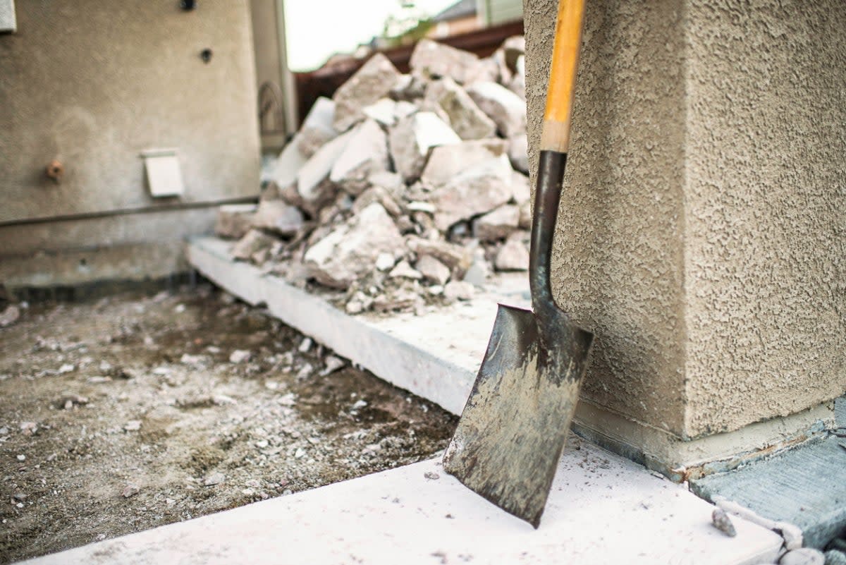 Shovel next to concrete debris