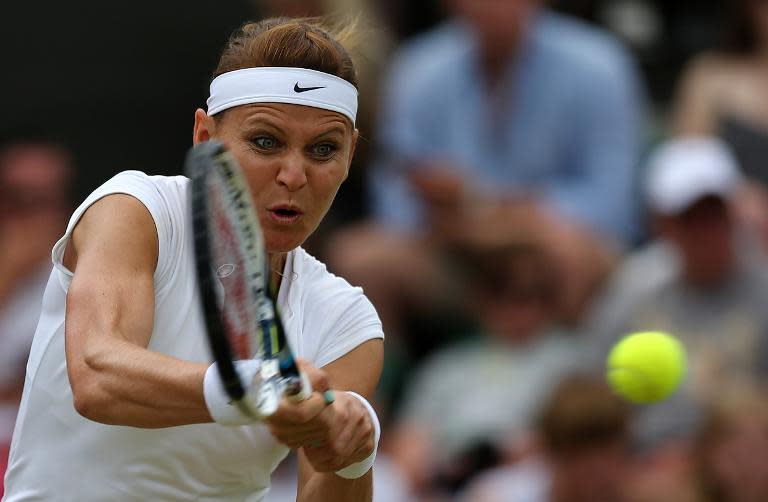 Czech Republic's Lucie Safarova was knocked out of the tournament as she was defeated 7-6 (7/1), 7-6 (7/4) by her American opponent on July 6, 2015 at Wimbledon