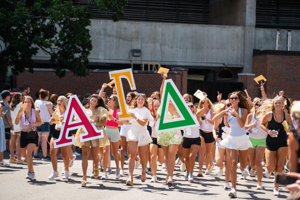 New members of Alpha Gamma Delta walk out of Bryant Denny Stadium to meet their new sorority sisters on Bid Day at The University of Alabama. Sunday August 14, 2022. [Photo/Will McLelland]