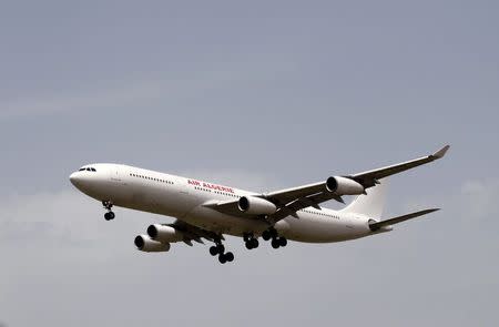 An Air Algerie Airways plane prepares to land at Houari Boumediene Airport in Algiers July 24, 2014. An Air Algerie flight crashed on Thursday en route from Ouagadougou in Burkina Faso to Algiers with 110 passengers on board, an Algerian aviation official said. REUTERS/Louafi Larbi