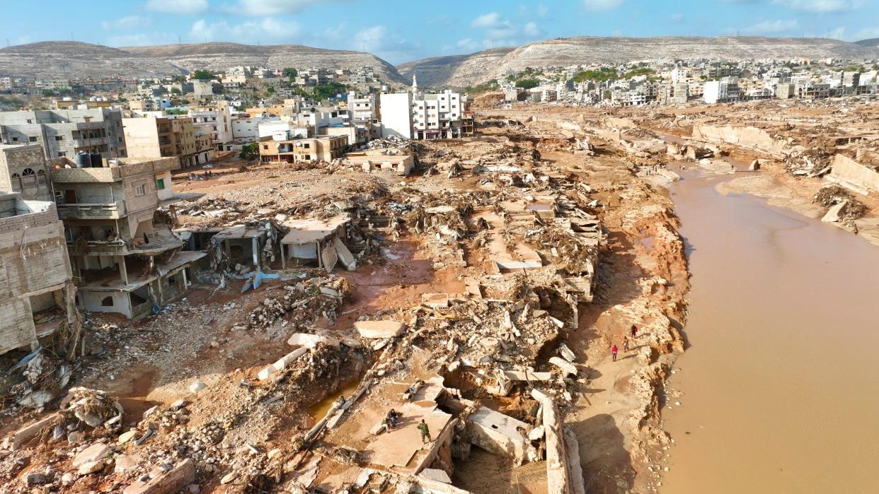 A general view of the city of Derna is seen on Tuesday, Sept. 12., 2023. Mediterranean storm Daniel caused devastating floods in Libya that broke dams and swept away entire neighborhoods in multiple coastal towns, the destruction appeared greatest in Derna city. (AP Photo/Jamal Alkomaty)