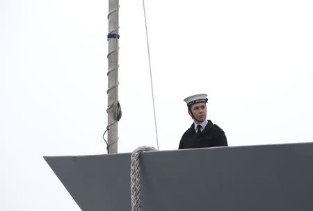 A female navy personnel is seen on the head of Royal Australian Navy's Adelaide class guided missile frigate HMAS Melbourne (III) at Qingdao Port for the 70th anniversary celebrations of the founding of the Chinese People's Liberation Army Navy (PLAN), in Qingdao, China April 21, 2019. REUTERS/Jason Lee