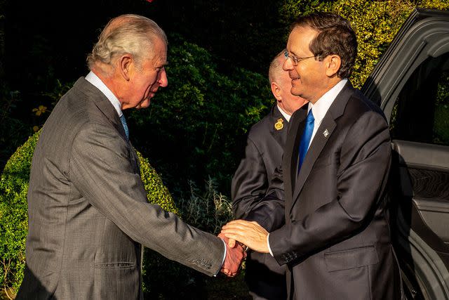 <p>BEN BIRCHALL/POOL/AFP via Getty Images</p> King Charles greets Israeli President Isaac Herzog at Highgrove House, Tetbury on November 22, 2021