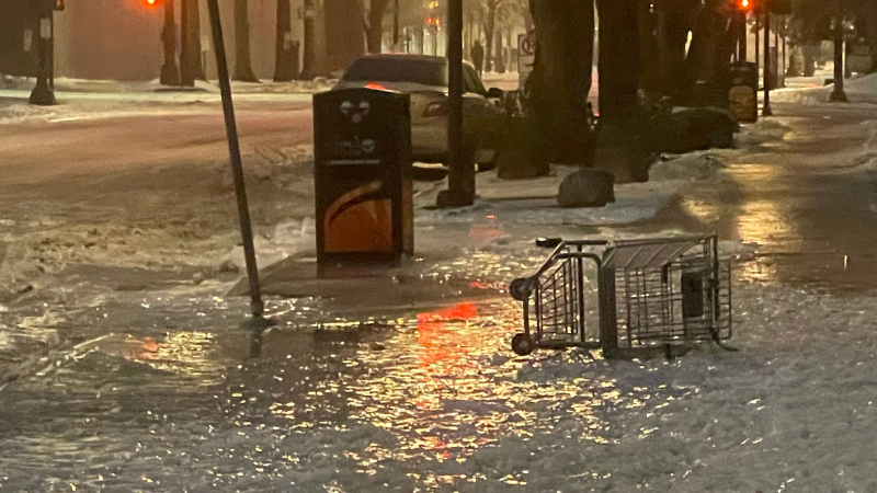 <em>A shopping cart frozen to the side walk during the ice storm on January 17, 2024 (KOIN)</em>