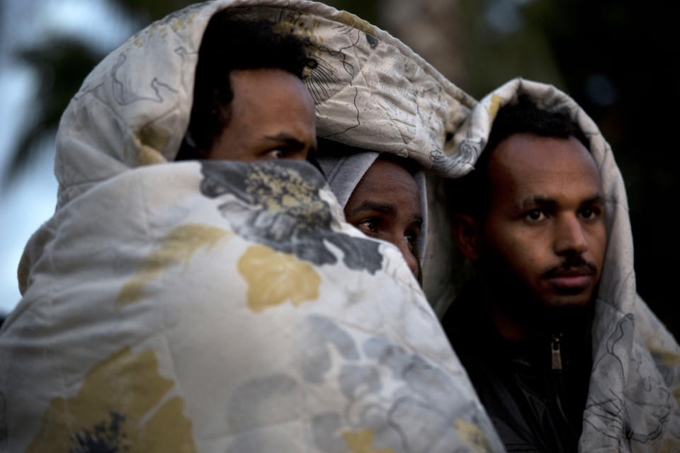 <p>African migrants cover themselves with blankets in the cold during a protest demanding asylum and work rights from the Israeli government in Tel Aviv, Israel, Feb. 3, 2014. (Photo: Oded Balilty/AP) </p>