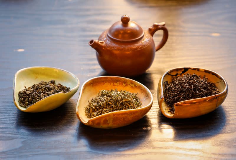 A view shows a pot and utensils with various types of tea leaves in a tea house in this picture illustration