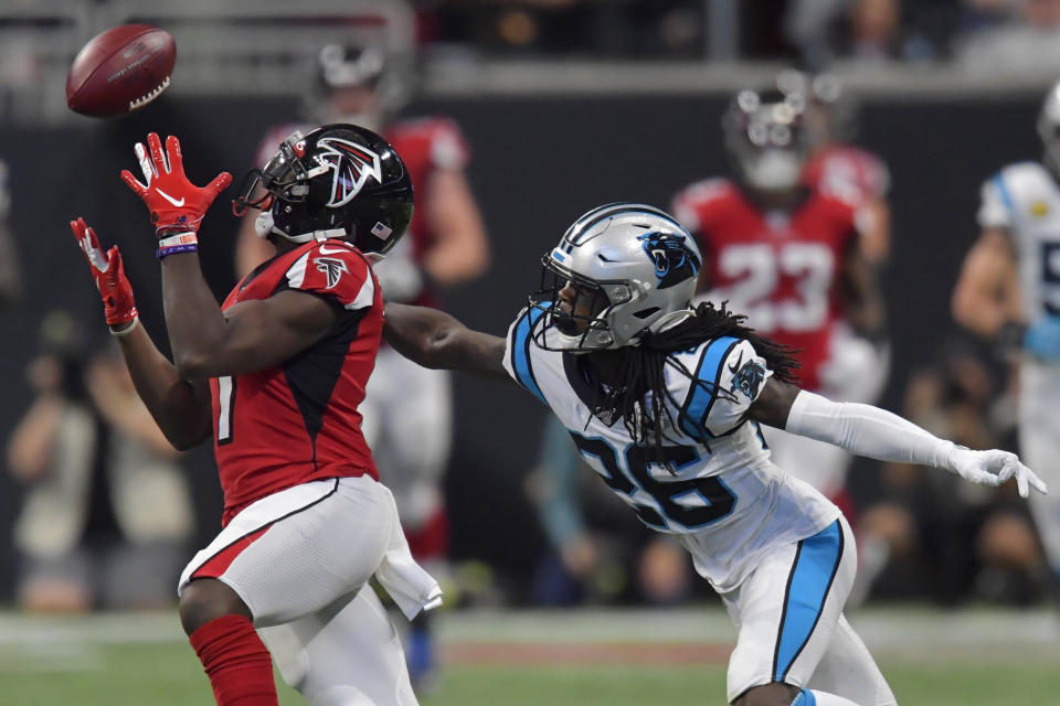 Atlanta Falcons wide receiver Olamide Zaccheaus (17) makes the catch against Carolina Panthers cornerback Donte Jackson (26) during the second half of an NFL football game, Sunday, Dec. 8, 2019, in Atlanta. (AP Photo/Mike Stewart)