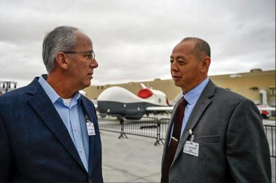 Rapid City Mayor Steve Allender, left, is greeted by Gen. John R. Edwards, a member of the National Security Council and former commander of the 28th Bomb Wing at Ellsworth Air Force Base, while attending an expo ahead of the B-21 unveiling ceremony on Friday at Air Force Plant 42, Site 4, Northrop Grumman in Palmdale, Calif.