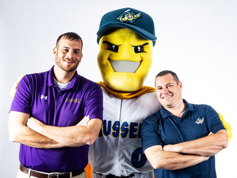 John Martin, right, the majority owner of the Mighty Mussels poses with Chris Peters, the president of the Mighty Mussels minor league baseball team and their mascot.