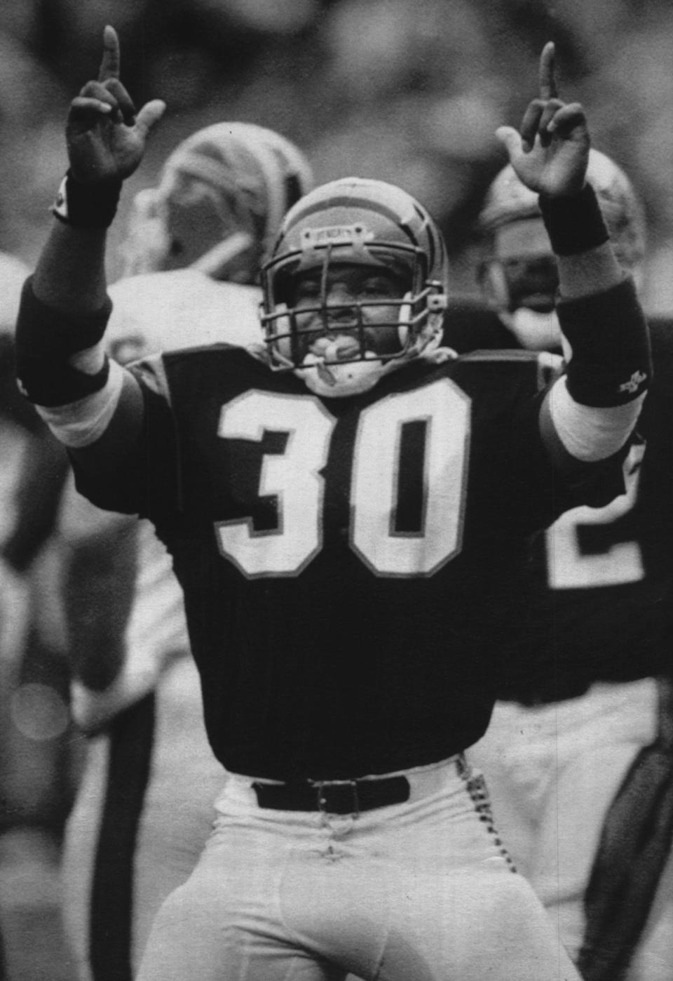 Cincinnati Bengals rookie fullback Ickey Woods does a dance he calls the "Ickey Shuffle" after scoring a touchdown in this Nov. 27, 1988, file photo. Woods scored three touchdowns in the Bengals 35-21 win over the Buffalo Bills.