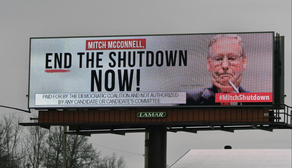 An electronic billboard, sponsored by the Democratic Coalition, shown Saturday, Jan. 12, 2019 in Nicholasville, Ky. McConnell, who is up for re-election in 2020 in a state where Trump tends to be more popular than he is, sees no other choice than to stand back and let the president who took the country into the shutdown decide how he wants to get out of it. (AP Photo/Timothy D. Easley)