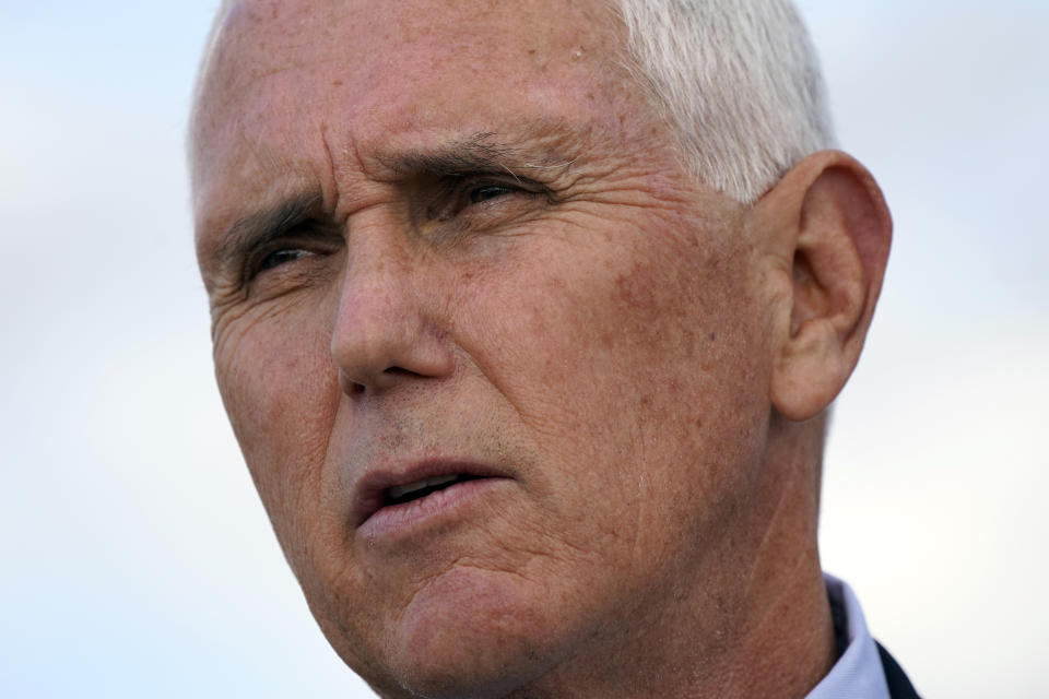 Vice President Mike Pence speaks to members of the media at Andrews Air Force Base, Md., Monday, Oct. 5, 2020, as he leaves Washington for Utah ahead of the vice presidential debate schedule for Oct. 7.(AP Photo/Jacquelyn Martin)