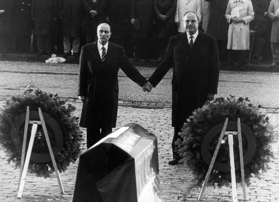<p>Helmut Kohl (R) stands hand in hand with former French President Francois Mitterrand (L) in this 1984 file photo during their visit to the former Verdun battlefields, Sept. 22, 1984. (Reuters) </p>