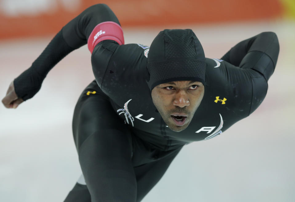 Shani Davis of the U.S. competes in the second heat of the men's 500-meter speedskating race at the Adler Arena Skating Center during the 2014 Winter Olympics, Monday, Feb. 10, 2014, in Sochi, Russia. (AP Photo/Matt Dunham)