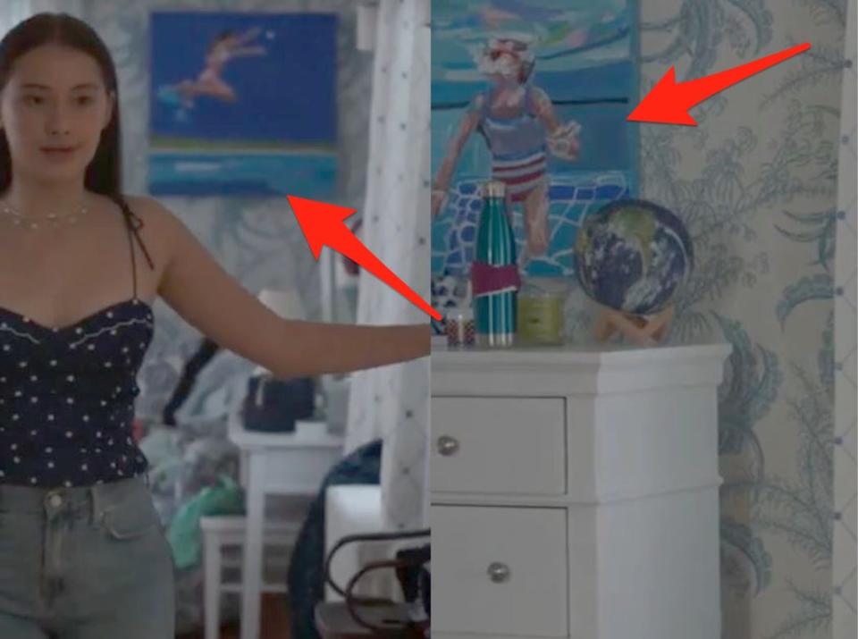 belly's room pointing to a  painting next to a painting above her dresser