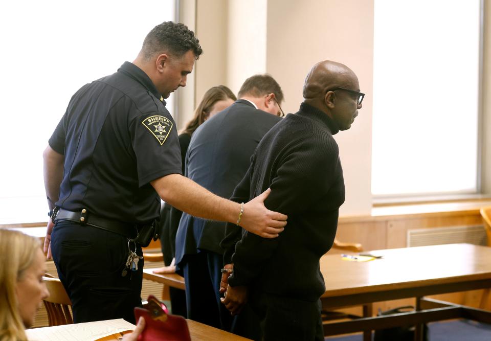 Timothy Williams is led away in handcuffs after being convicted of the rape and murder of Wendy Jerome in 1984.